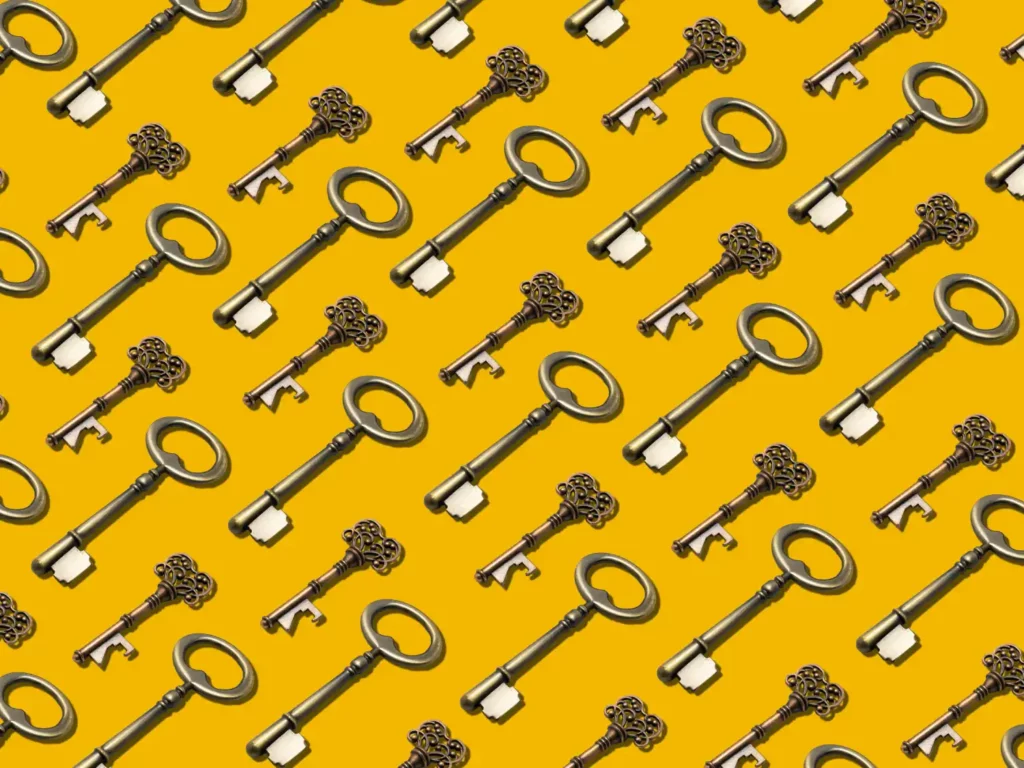a bunch of antique style keys that are on a yellow background. Photo by Alp Duran on Unsplash https://unsplash.com/photos/vLuj--T3Fp8